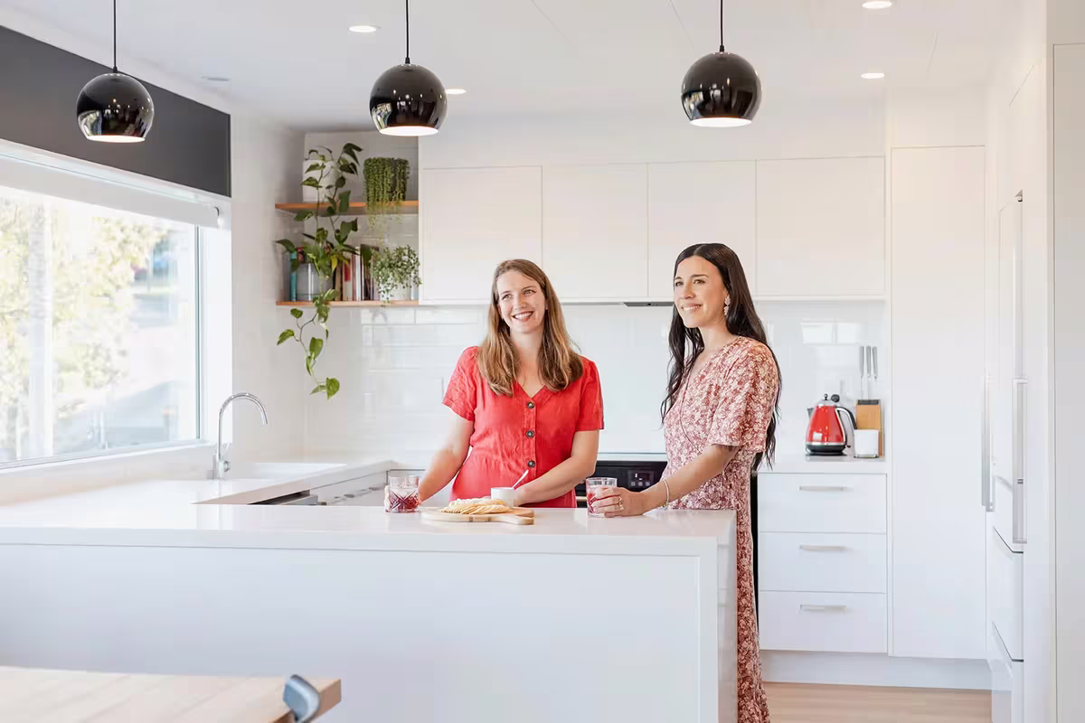 Bright white custom kitchen with island bench by Kamo Kitchens